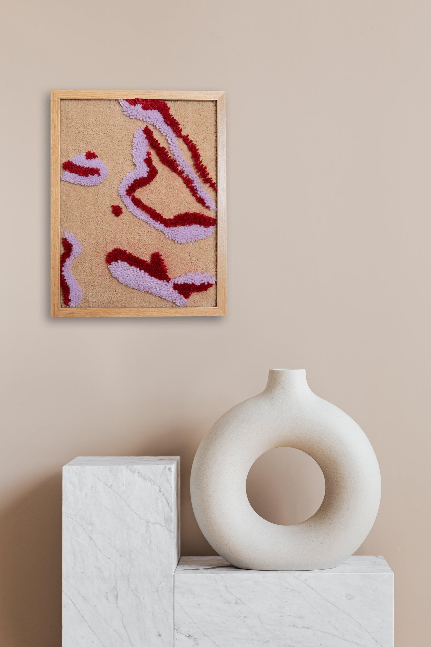 Tufted fabric artwork of a female body in double-line silhouette, framed in rosewood. Dimensions 320mm x 420mm.